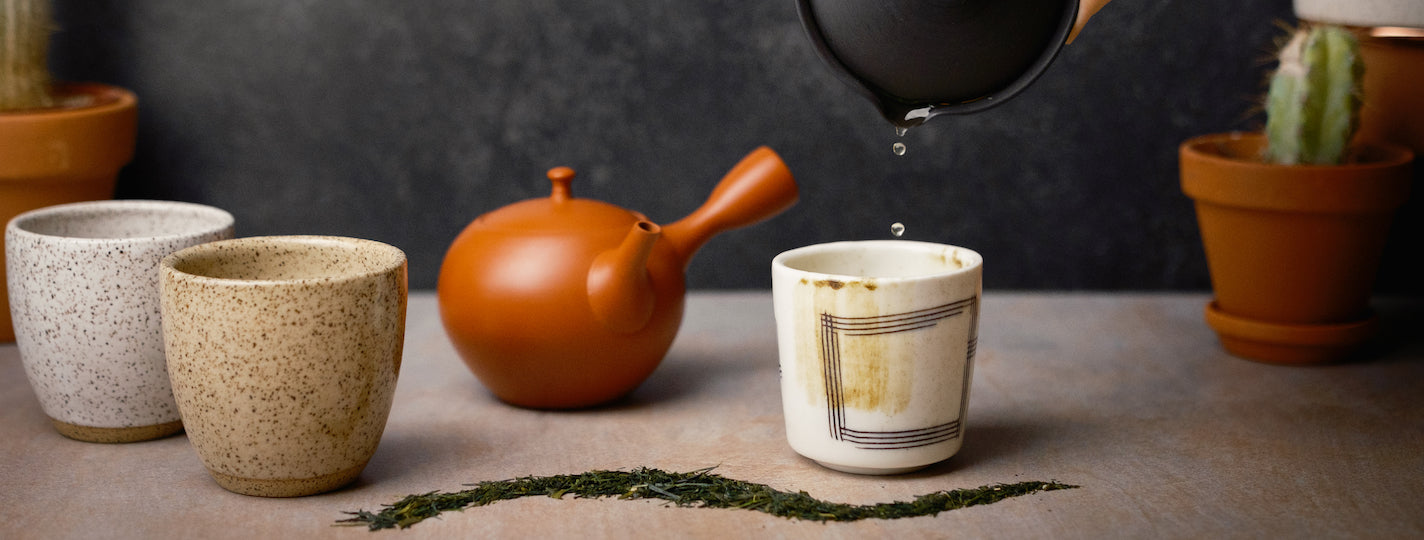 Green Tea being poured into a cup 