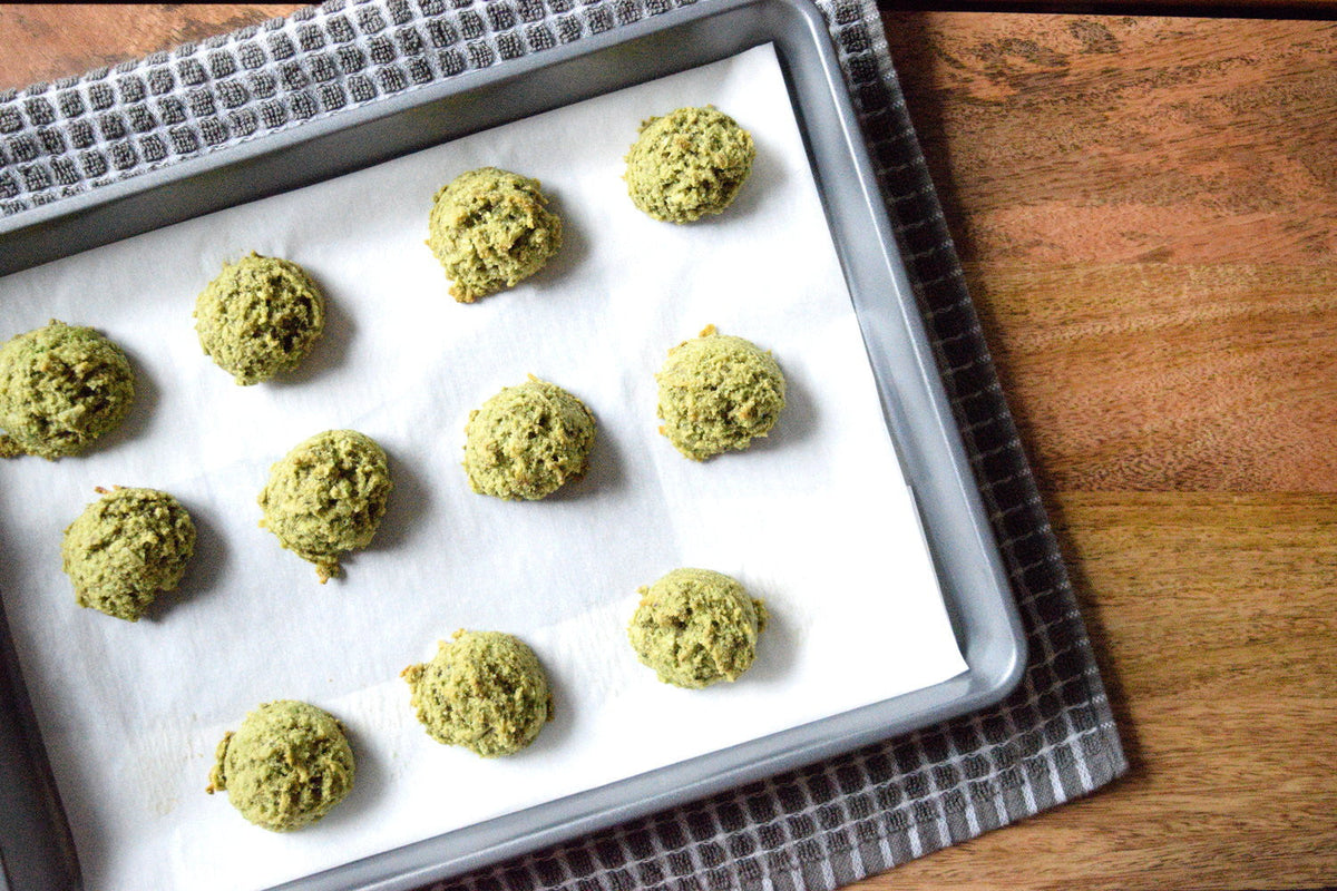 matcha green tea macaroons on a sheet pan