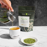 Organic Kuwacha being poured into a cup