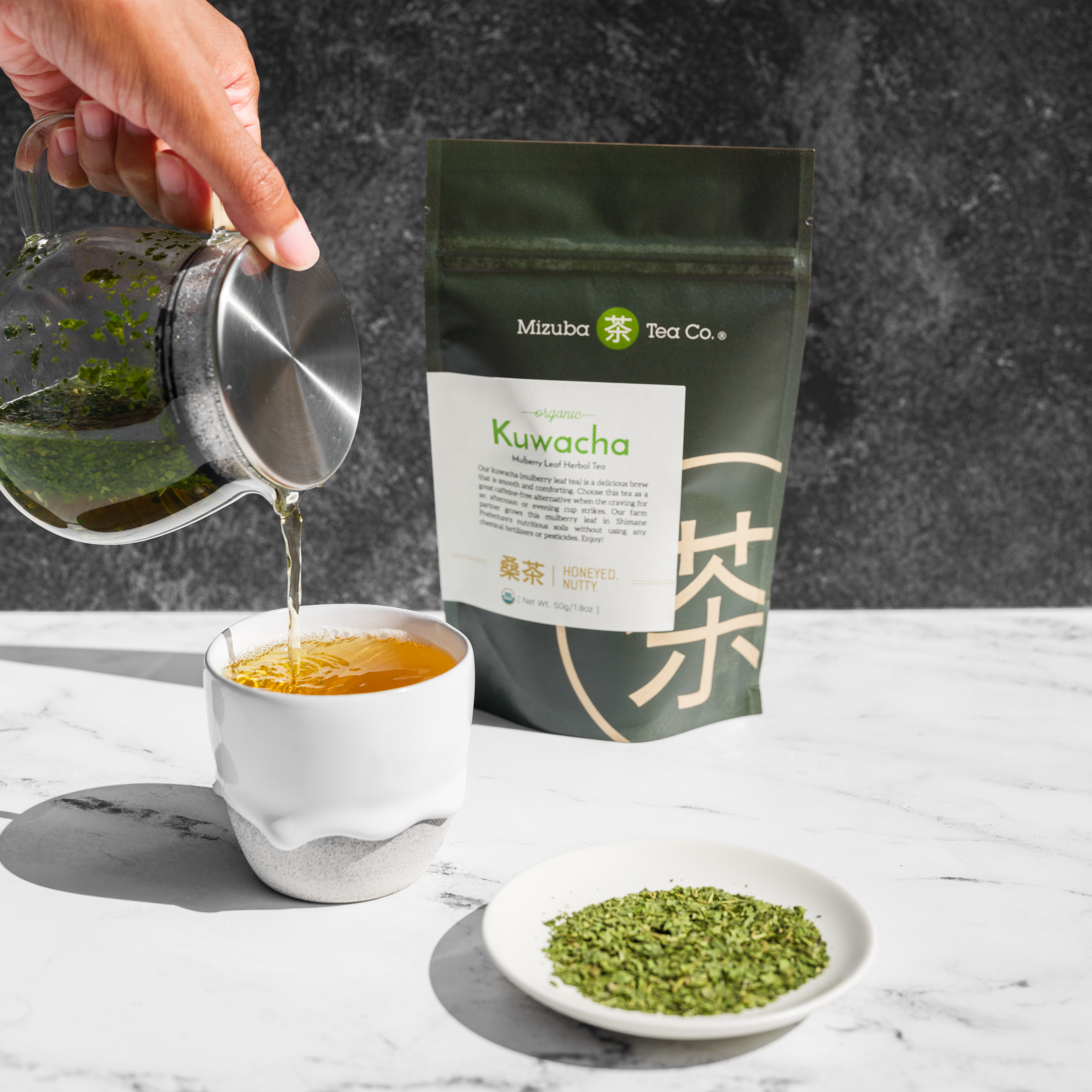 Organic Kuwacha being poured into a cup