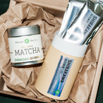 Mizuba Matcha Shirakawa Tsuji San tea canister and packets on brown paper.