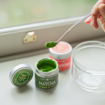 Matcha being scooped from Mizuba Tea tin