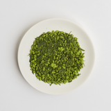 Japanese Organic Matcha Covered Genmaicha Loose Leaf Green Tea on a white plate