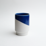 Blue and white matcha tea cup on white background