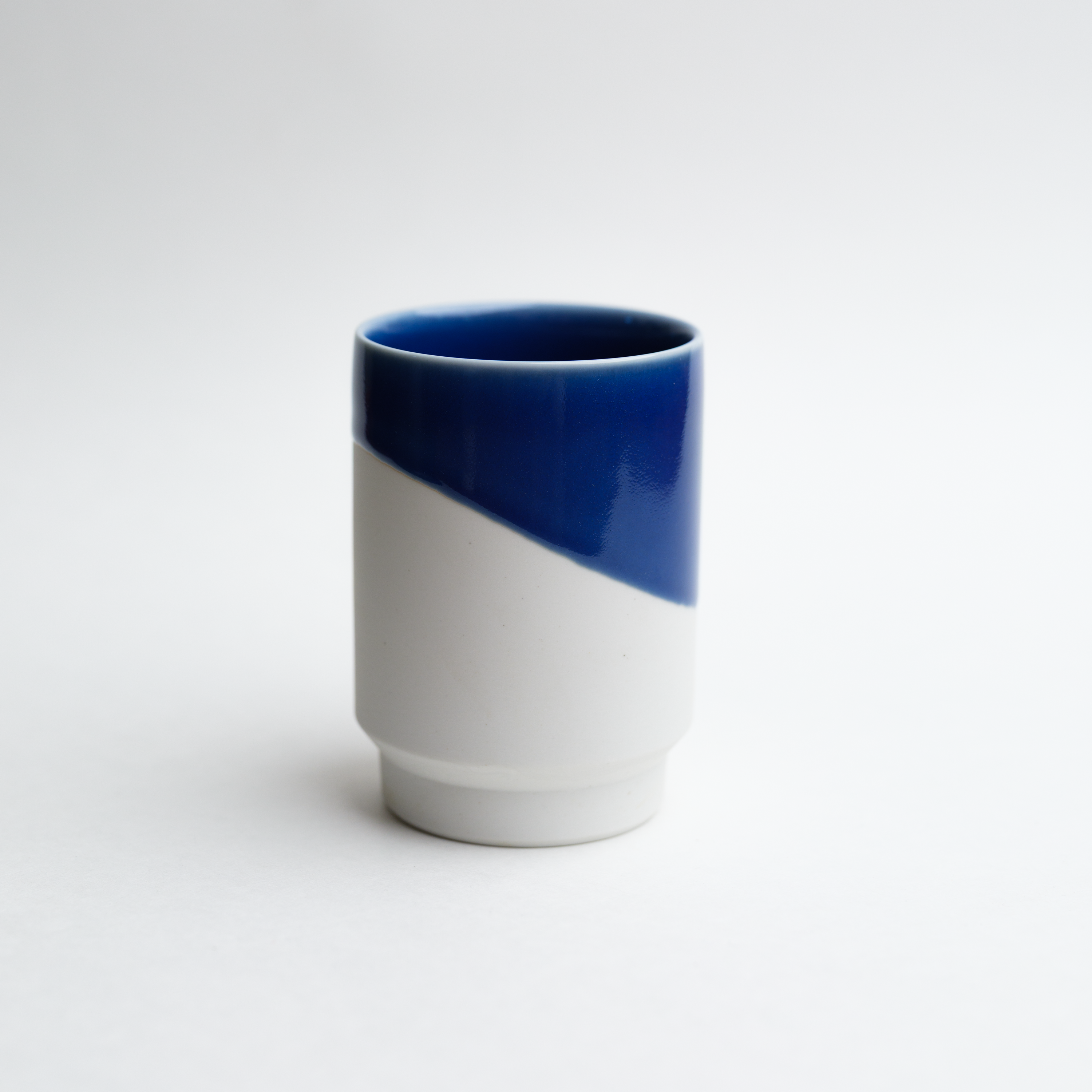 Blue and white matcha tea cup on white background