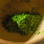 Close up of fine, verdant Japanese matcha green tea powder