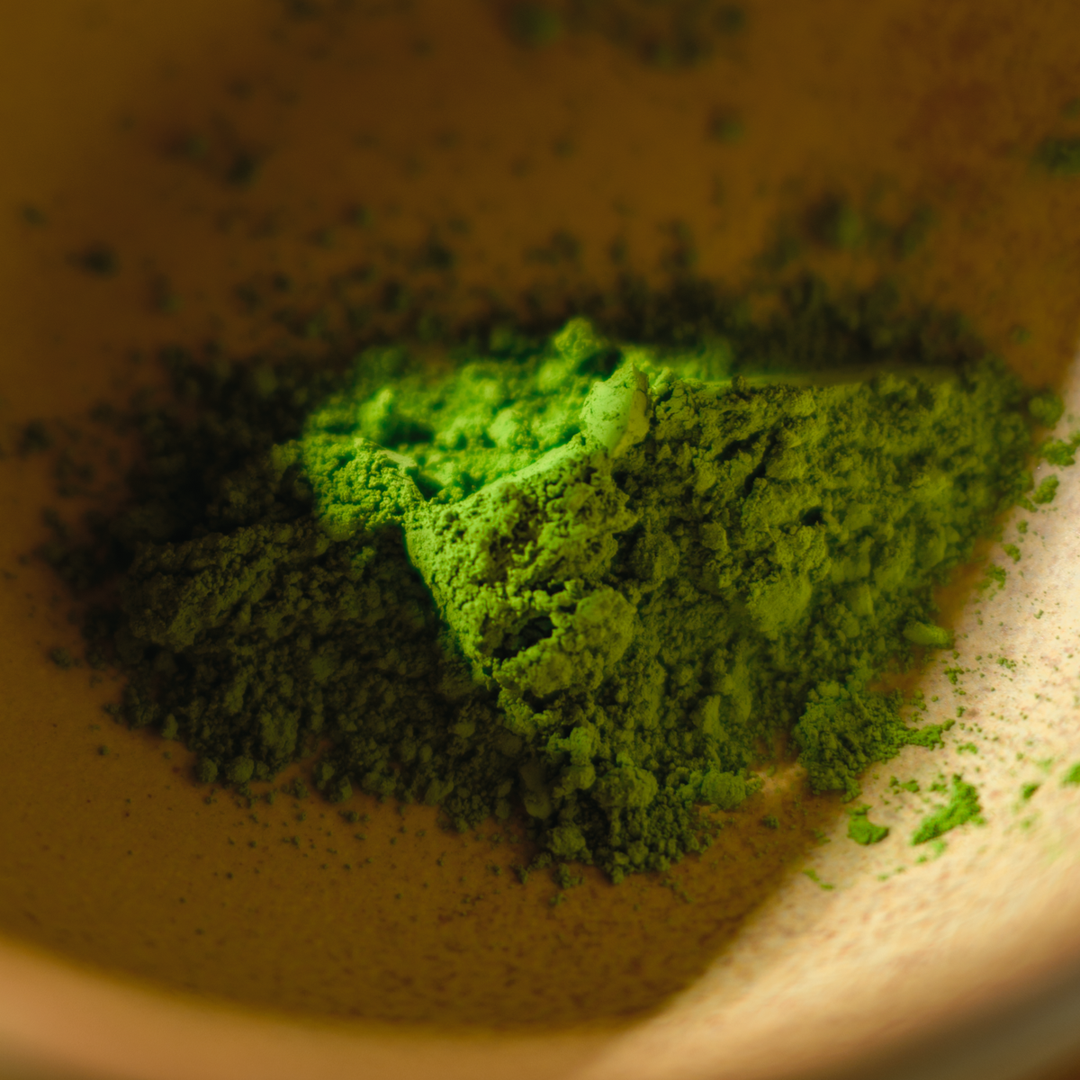 Close up of fine, verdant Japanese matcha green tea powder