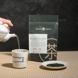 Organic Koshun Sencha with cups and teapot
