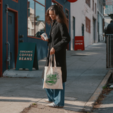 Woman holding Mizuba Tea Canvas bag